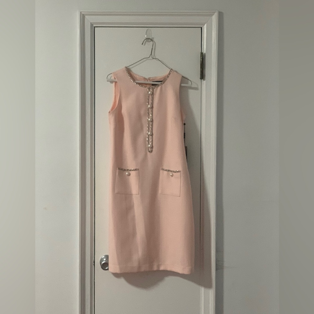 Karl Largerfeld pink sheath dress with pearl buttons.